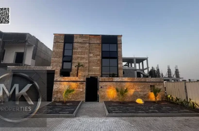 Luxury Villa for Sale in Al Alia – Modern Design & Prime Location Elegant stone façade Modern entrance