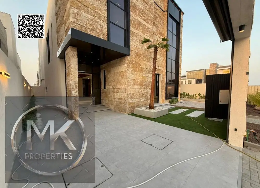Luxury Villa for Sale in Al Alia – Modern Design & Prime Location Elegant stone façade Modern entrance